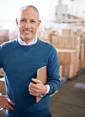 I put the logic in logisitics. Portrait of a mature man standing on the floor of a warehouse